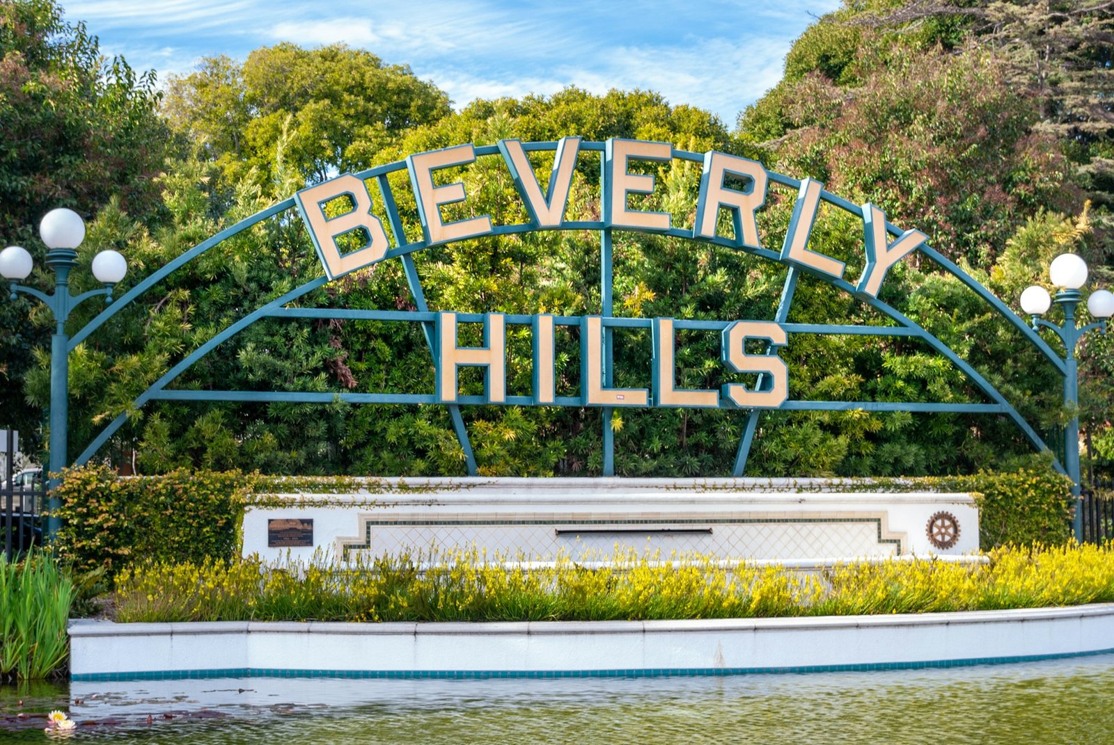 Beverly Hills sign with water and palms
